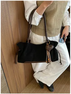 Black vintage shoulder bag for women, large capacity tote bag with brown straps and heart charm.