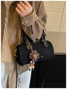 Zwarte suède cilinder kussen schoudertas voor vrouwen retro mode crossbody handtas uniek chic