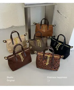 Retro minimalist women's handbag set detail showing various solid and leopard suede bags.