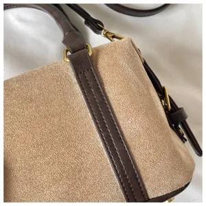 Detailed view of women retro suede leather patchwork handbag shoulder bag chic design beige brown