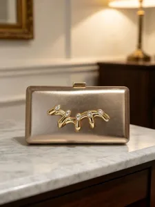 Exquisite gold metallic clutch bag featuring avant-garde liquid rhinestone ornament.