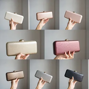 Metallic hardcase clutch evening bag detail showing multiple gorgeous color options.