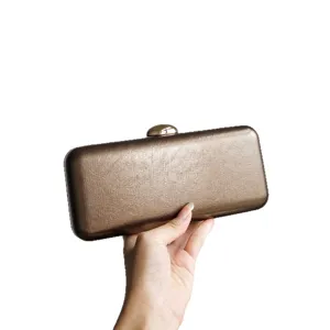 Metallic leather clutch bag for women, elegant evening party purse with secure metal clasp lock.