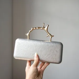 Silver leather evening clutch bag with unique gold branch metal handle for women party wedding.