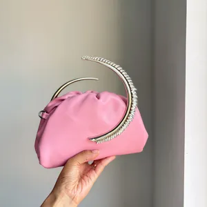 Exquisite pink pleated evening bag with stunning metallic crescent rhinestone handle details.