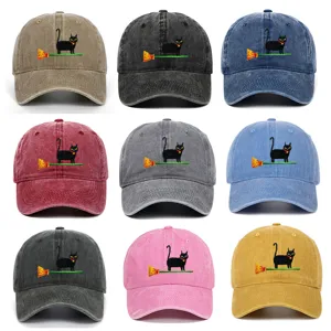 Close-up details of vintage washed baseball caps featuring cute black cat embroidery designs.