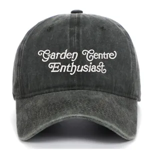 Vintage washed cotton baseball cap with stylish white embroidery, casual dad hat style.