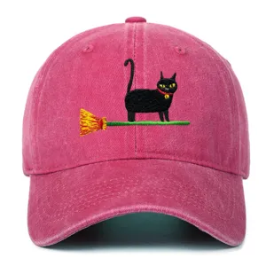 Detailed view of vintage washed pink baseball hat featuring cute black cat embroidery, sun shade.