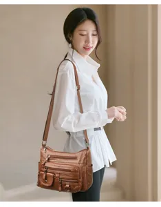 Stylish multi-pocket soft leather shoulder bag for women, retro casual crossbody handbag.