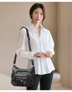Stylish black soft leather shoulder bag with multi pockets, casual crossbody design for women.