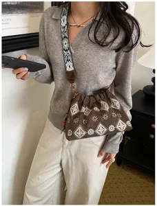 Vintage embroidered suede shoulder bag with wide strap, casual chic crossbody bag for women.