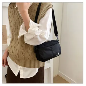 Bolso bandolera negro de nylon para mujer, bolso pequeño casual multi-bolsillos.