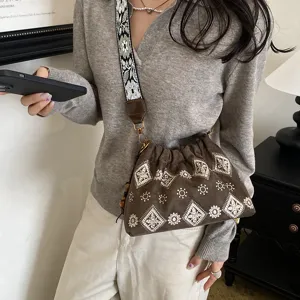 Retro embroidered canvas shoulder bag for women, casual crossbody bag with wide strap.