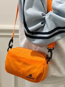 Bolso cruzado de teléfono ligero naranja con múltiples bolsillos de lona bandolera para mujer diario.