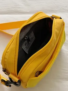 Bolso cruzado amarillo con múltiples bolsillos para mujer, bolso de nailon ligero.