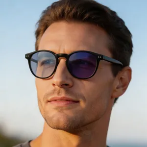 Detail view of men's classic oval sunglasses with UV protection and stylish black frame.
