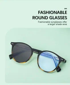 Fashionable round sunglasses for men with UV protection and stylish gradient frame design.