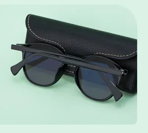 Detailed view of stylish men's oval sunglasses with UV protection and sleek black frames.