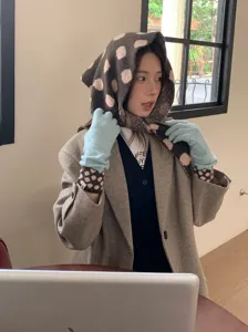 Chic polka dot knit triangular scarf and warm gloves set, cozy retro winter fashion accessory.