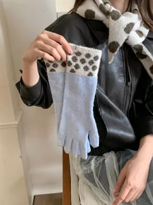 Chic polka dot knit gloves and cozy matching scarf set for women, warm winter accessories.