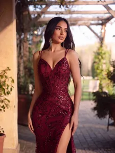Detailed close-up of the elegant burgundy sequin evening dress with corset boning.