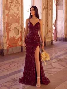 Stunning burgundy sequin evening dress with deep V-neck, high slit, and fishtail silhouette.