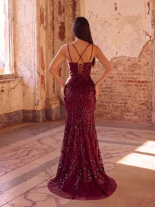 Detailed view of the backless sequin evening gown with elegant criss-cross straps and fishtail hem.