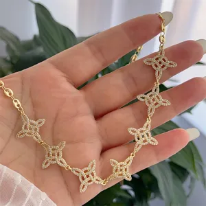 18K gold plated zircon witch knot necklace with fine link chain for retro jewelry detail.