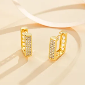 Elegant gold plated rectangular huggie hoop earrings with sparkling cubic zirconia stones.