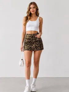 Chic leopard print denim mini skirt paired with a basic white crop top for a trendy look.