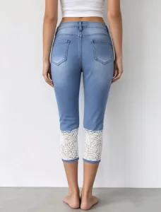 Washed stretch lace cropped jeans for women, casual slim fit denim trousers with floral lace.