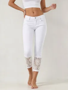 White cropped stretch jeans for women featuring elegant lace cuffs. Casual and fashionable.