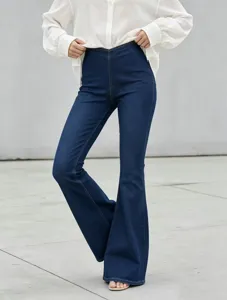 Detail view of high waist stretch denim flare pants, stylish casual women trousers.