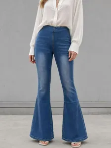 High-waisted blue flare jeans detail view showing stretch denim fabric and slim fit design.