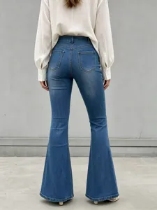 Back view detail of stretch high waist flare denim jeans paired with white blouse.