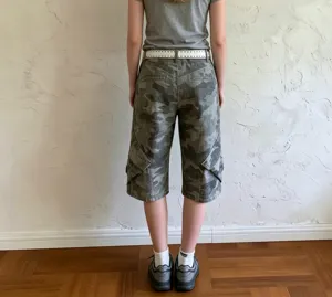 Back view detail of women's camouflage cargo capri pants with low waist and side pockets.