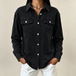 Close-up detail of women's black denim long sleeve shirt lapel single breasted jacket.