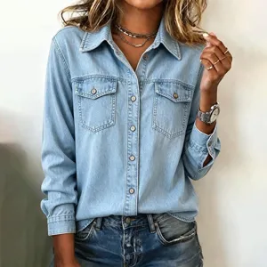Detail view of women's light blue long sleeve denim shirt featuring classic turn-down collar.