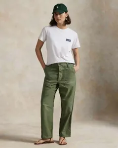 Casual white short-sleeve t-shirt with retro green utility pants and matching cap.