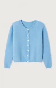 Close-up detailed view of the soft light blue knit cardigan featuring elegant pearl buttons.