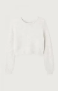 Detailed view of a fuzzy cropped knit sweater featuring a soft crewneck and long sleeves.