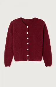 Detailed view of women fuzzy knit cardigan, soft texture and button down front style.