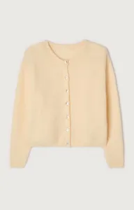 Detailed close-up view of the soft butter yellow knit cardigan with front button closure.