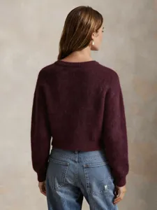 Wine red fuzzy cropped pullover sweater worn by a model from the back view, elegant style.