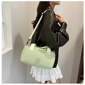 Sac bandoulière cylindrique vert léger, sac crossover élégant pour le travail et le quotidien.