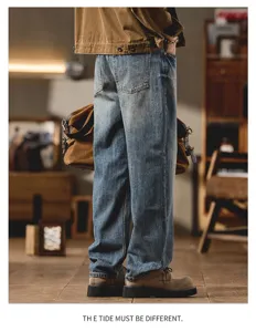 Detailed back view of men vintage washed loose curved denim jeans in casual style.