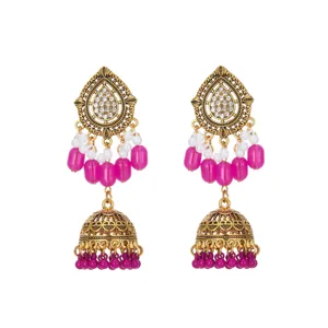 Exquisite ethnic drop jhumka earrings with vintage gold filigree and pink beads detail.