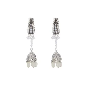 Detailed close-up view of vintage silver rhinestone jhumka earrings with pearl tassels.