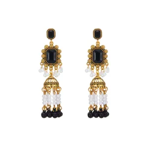 Vintage gold-tone black stone pearl tassel jhumka earrings close-up display view.