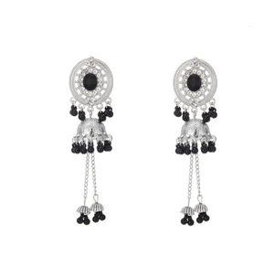 Exquisite close-up of exotic silver-tone jhumka earrings featuring black beaded accents and rhinestones.